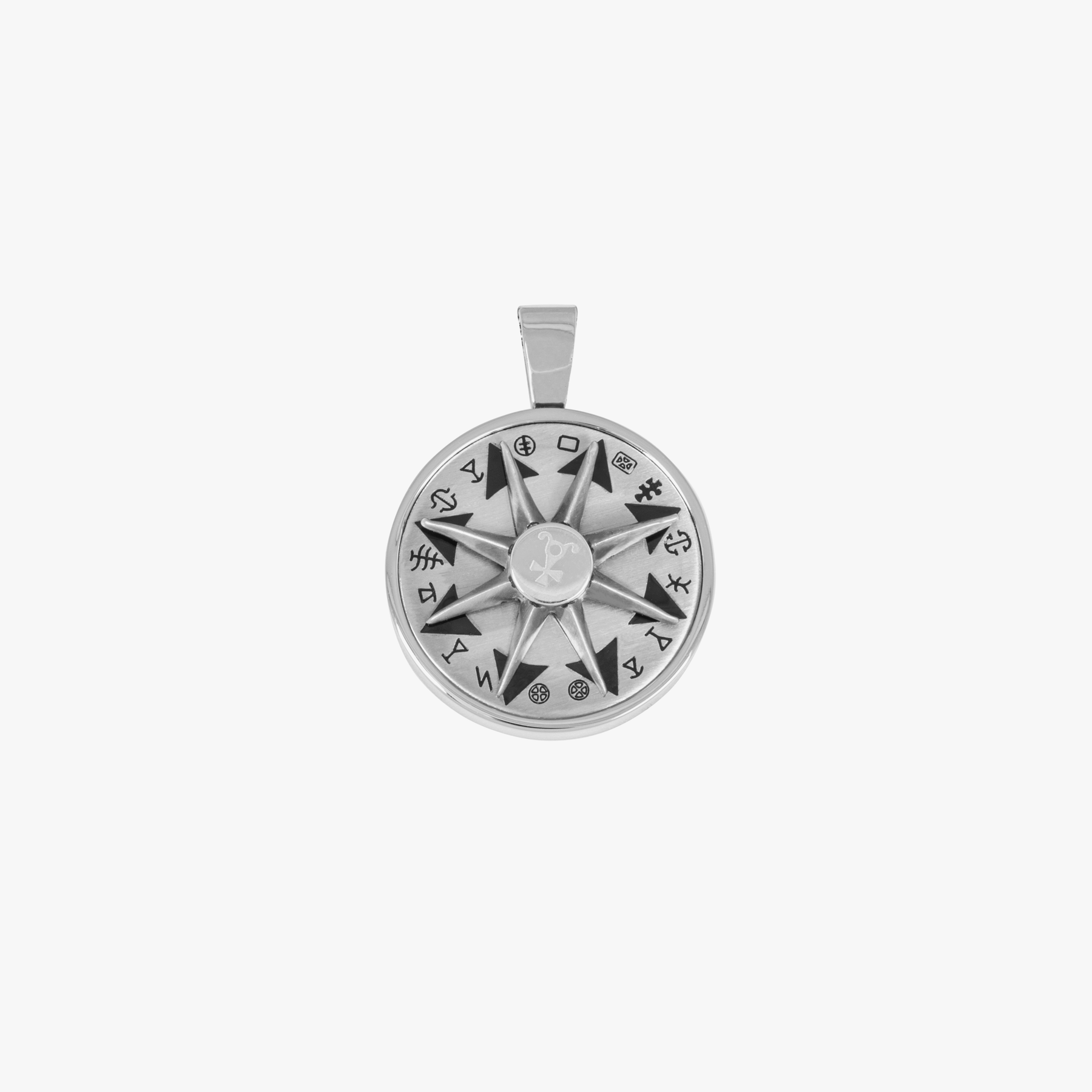 A stainless steel rotating compass amulet necklace with engraved symbols, attached to a silver chain.
