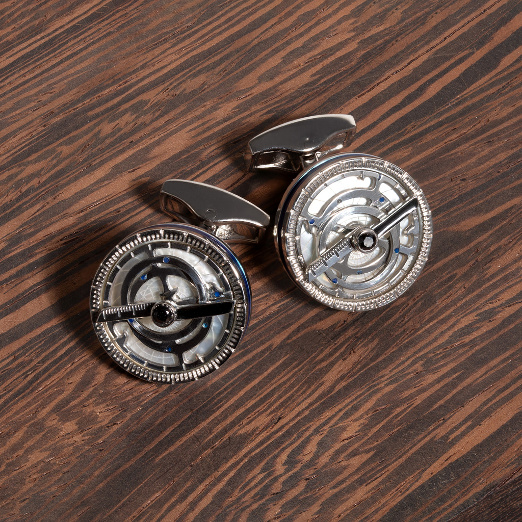 Rotating Astrolabe cufflinks with white mother of pearl, Swarovski crystals, and navy enamel celestial design.