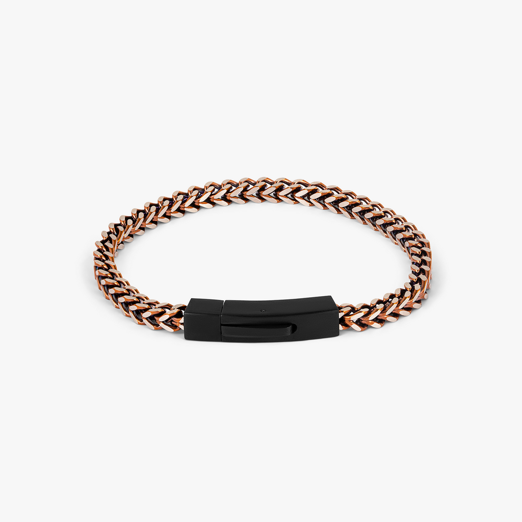 A matte black and brown chevron-patterned stainless steel bracelet with a clasp.