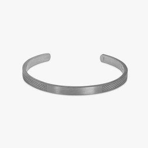 A matte black rhodium-plated silver bangle with diamond-pattern engraved sides.