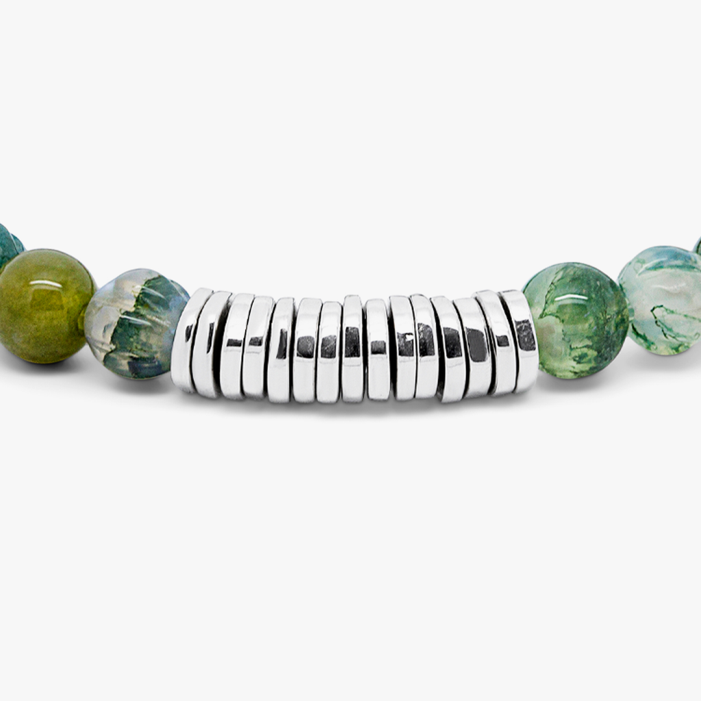 A rhodium-plated silver bracelet with green moss agate beads and sterling silver discs