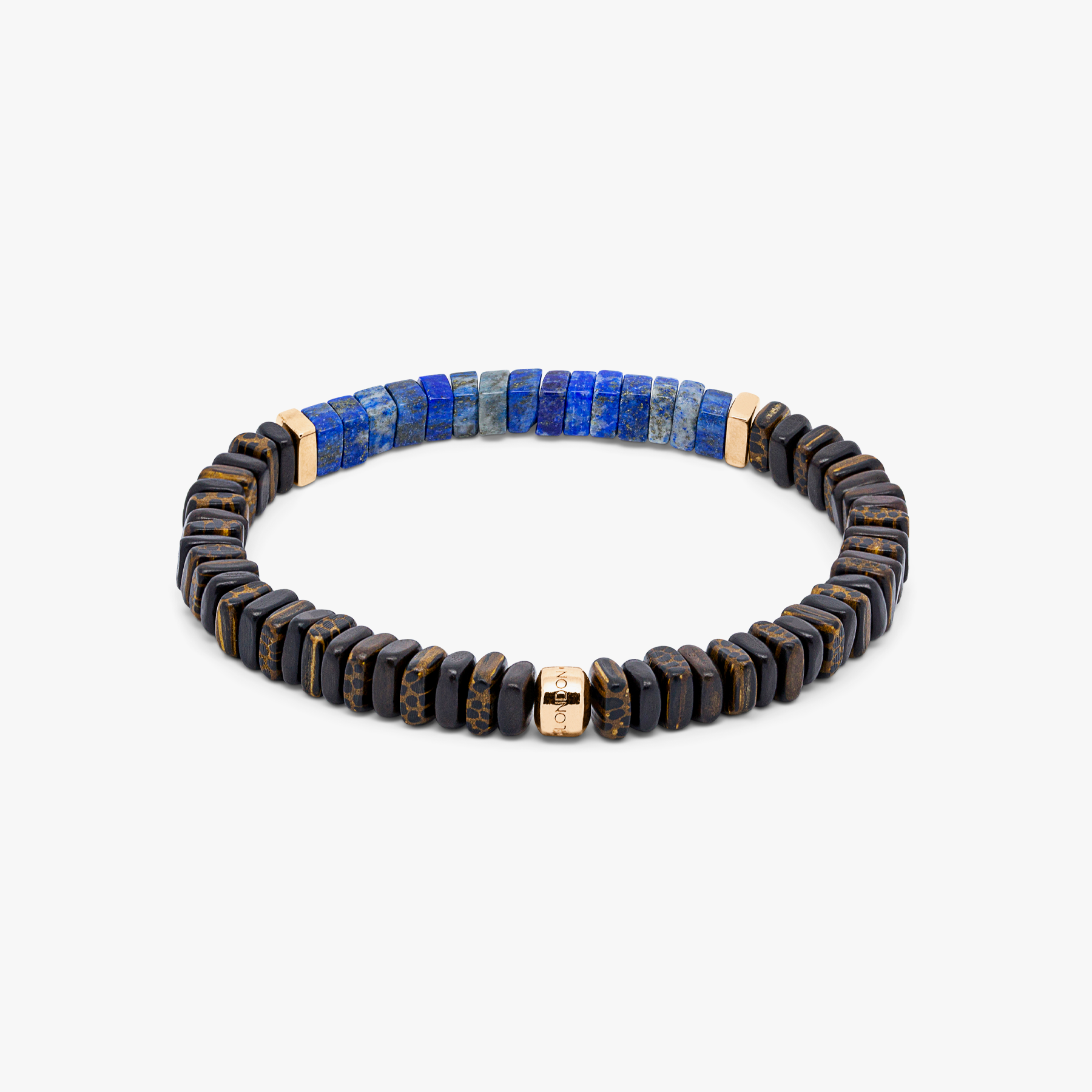 A bracelet with a combination of dark and light wood beads, accented by rose gold-colored sterling silver discs and a central lapis stone.