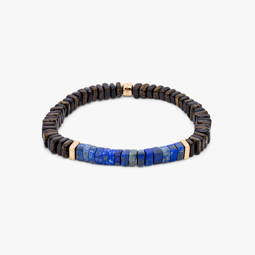 A bracelet with a combination of dark and light wood beads, accented by rose gold-colored sterling silver discs and a central lapis stone.