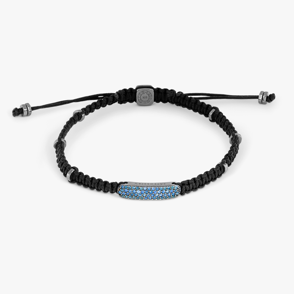 A black macrame bracelet with ruthenium plating and blue sapphire accents.
