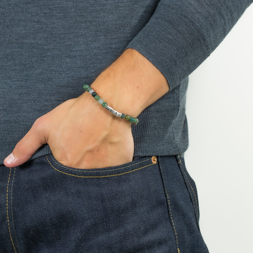 A rhodium-plated silver bracelet with green moss agate beads and sterling silver discs