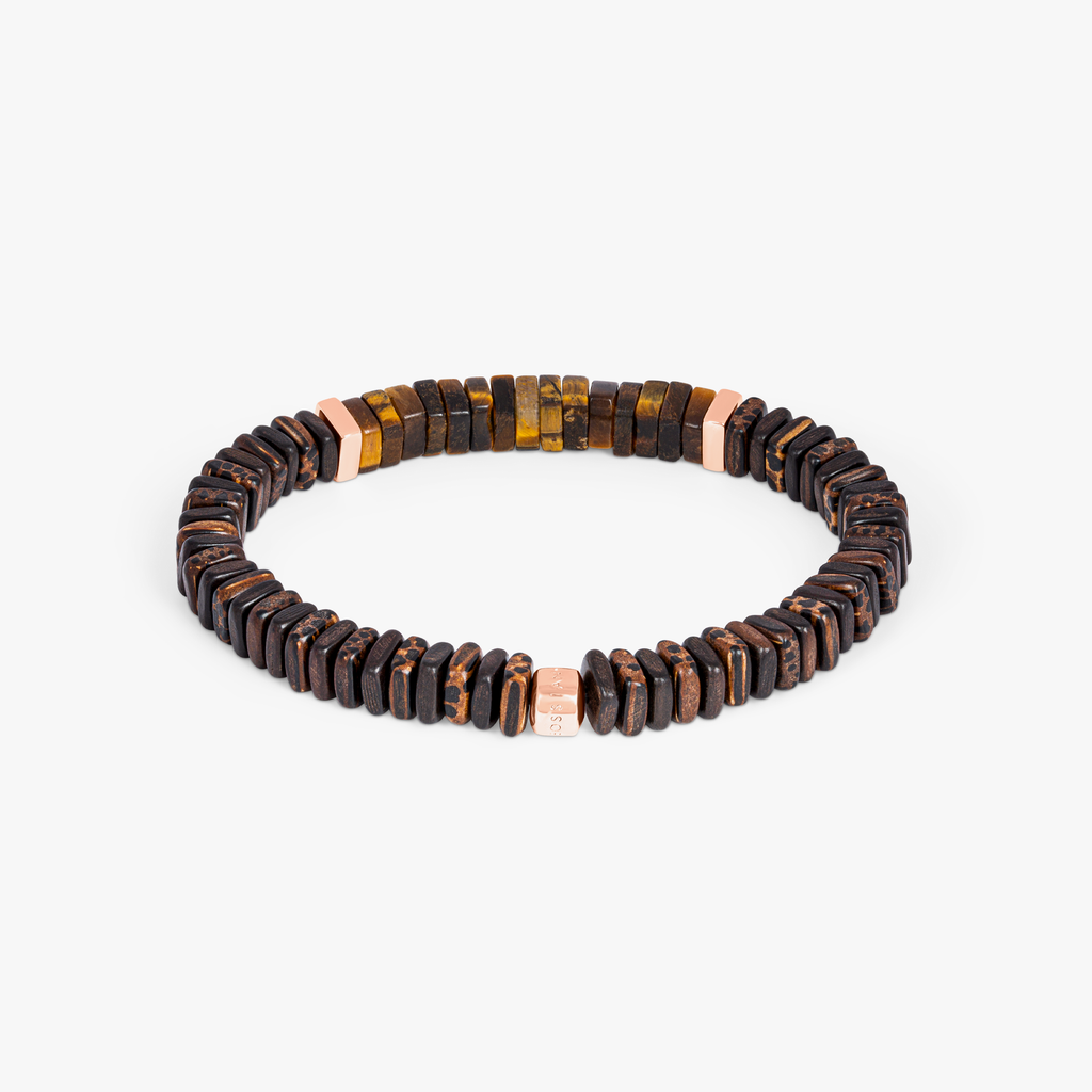 A bracelet made of tiger eye, palm and ebony wood with rose gold plated sterling silver accents.