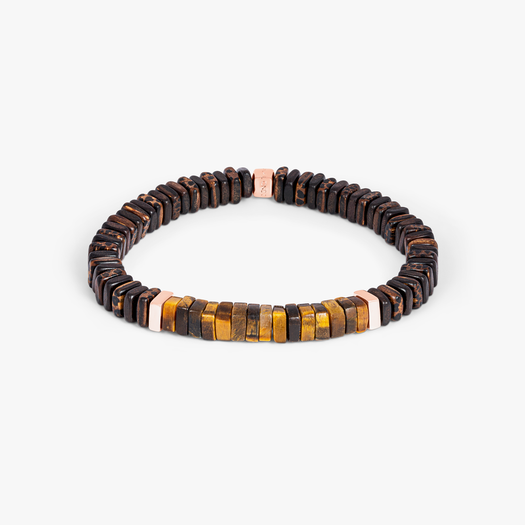 A bracelet made of tiger eye, palm and ebony wood with rose gold plated sterling silver accents.
