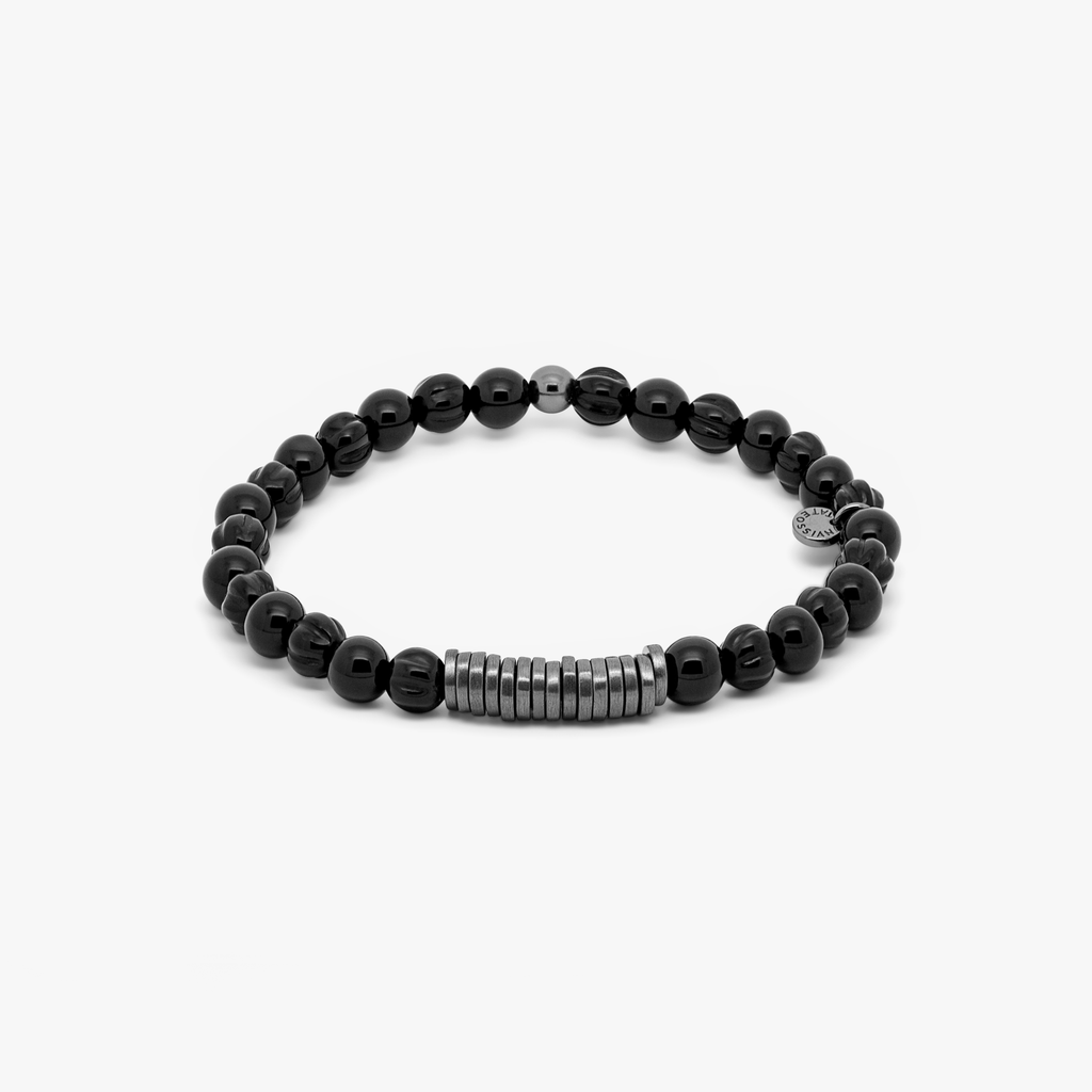 A black beaded bracelet with black ruthenium plated sterling silver discs.
