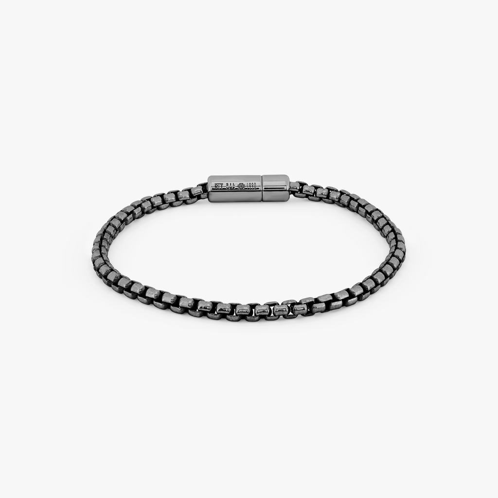 A black ruthenium plated silver box chain bracelet with a pop clasp closure.