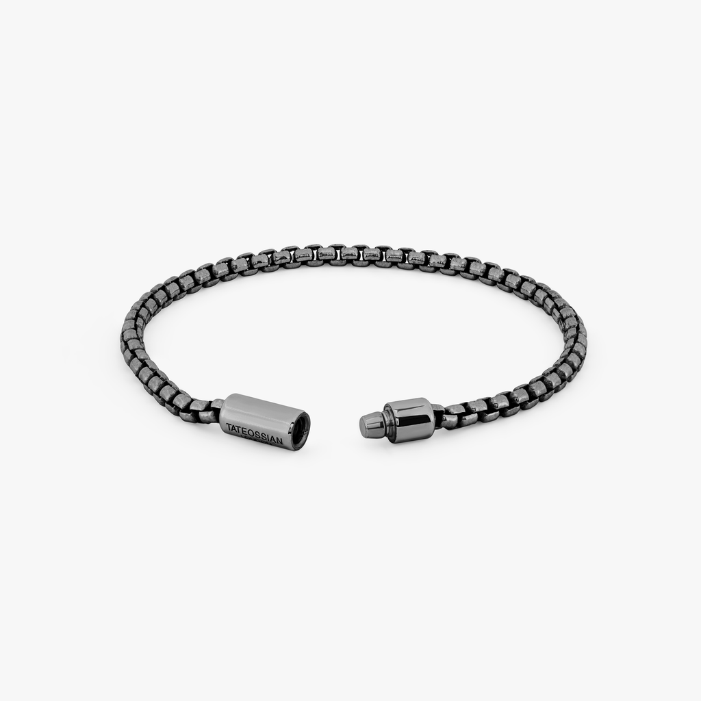 A black ruthenium plated silver box chain bracelet with a pop clasp closure.