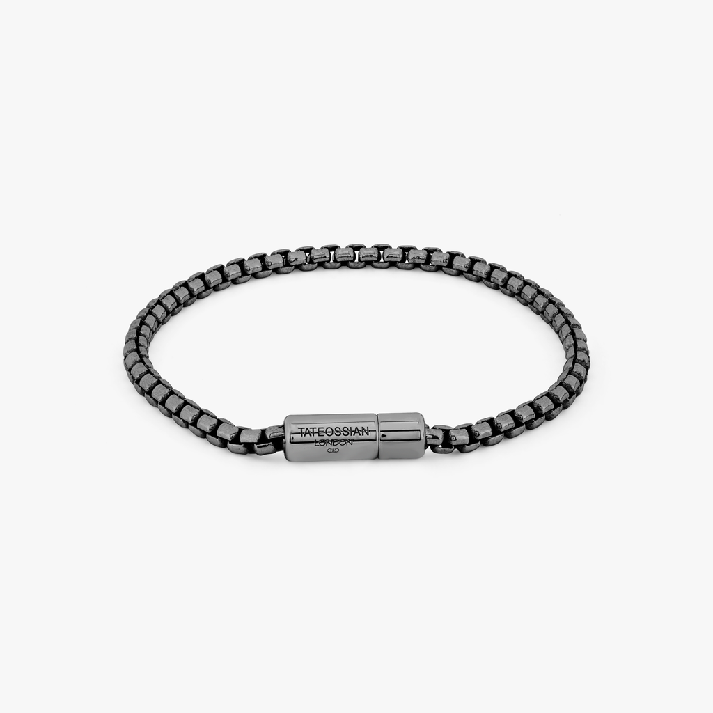 A black ruthenium plated silver box chain bracelet with a pop clasp closure.