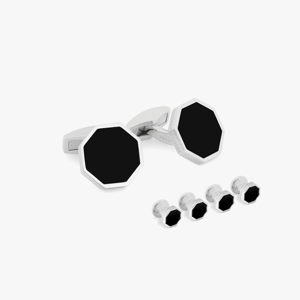 A set of black onyx cufflinks with a London Eye-inspired design, accompanied by matching shirt studs, against a white background.